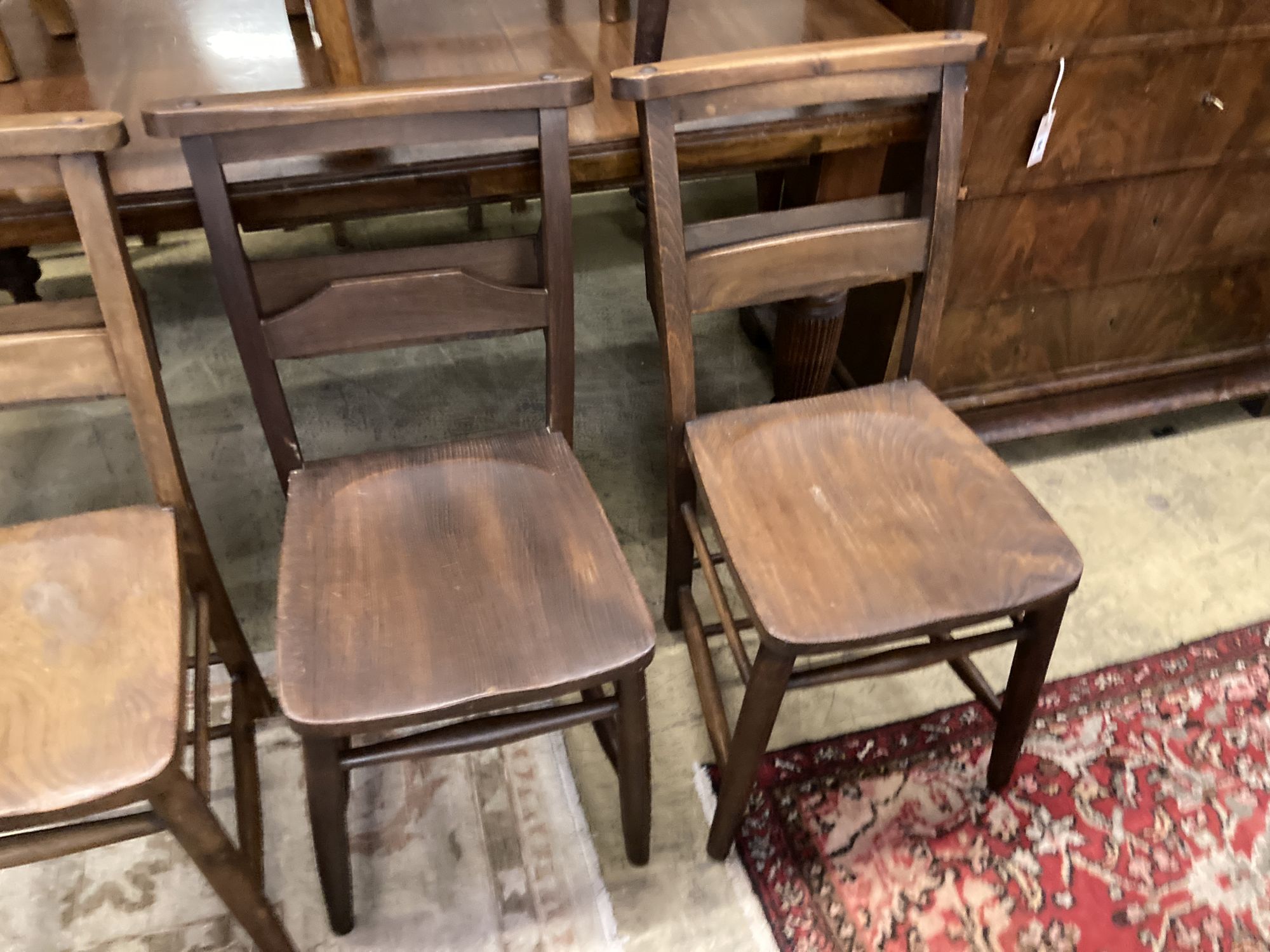 Seven Victorian elm and beech chapel chairs